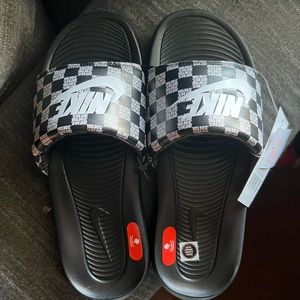 Mens Nike slides.